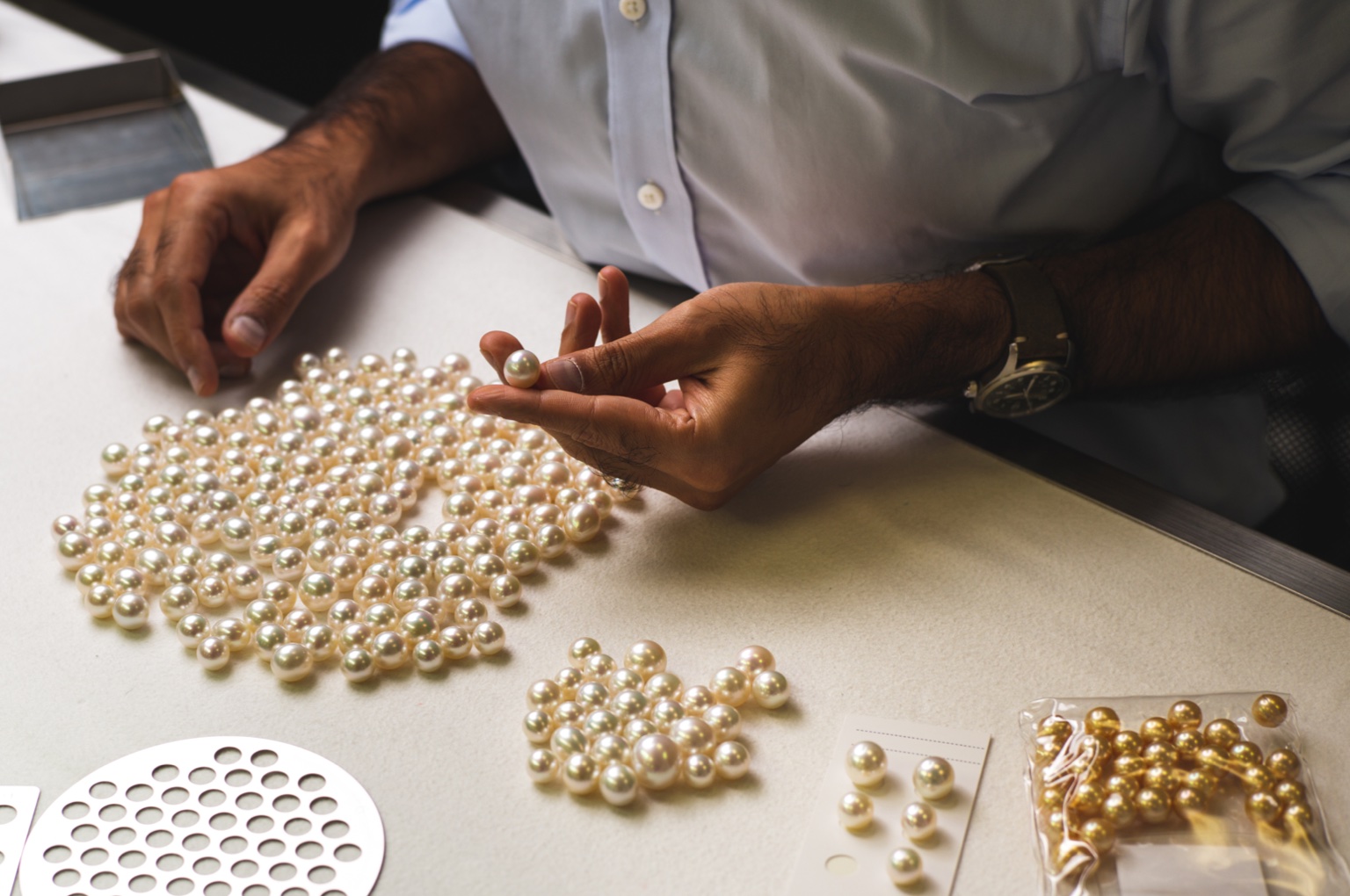 Grader evaluating South Sea Pearls